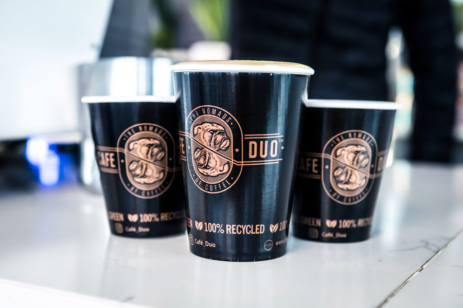 Three freshly prepared Café Duo coffees ready to serve